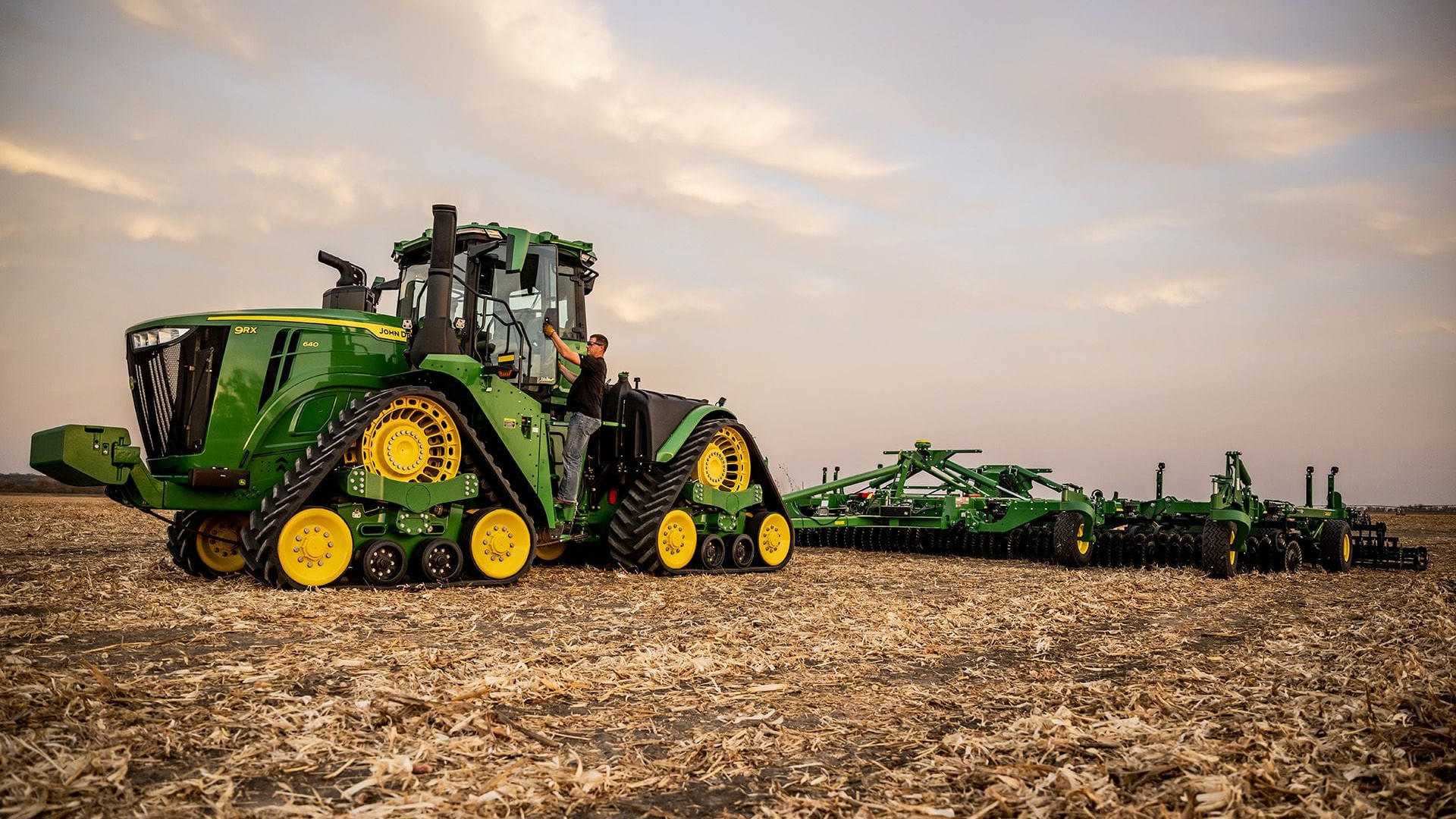 Autonomous 9RX at a field edge at dusk