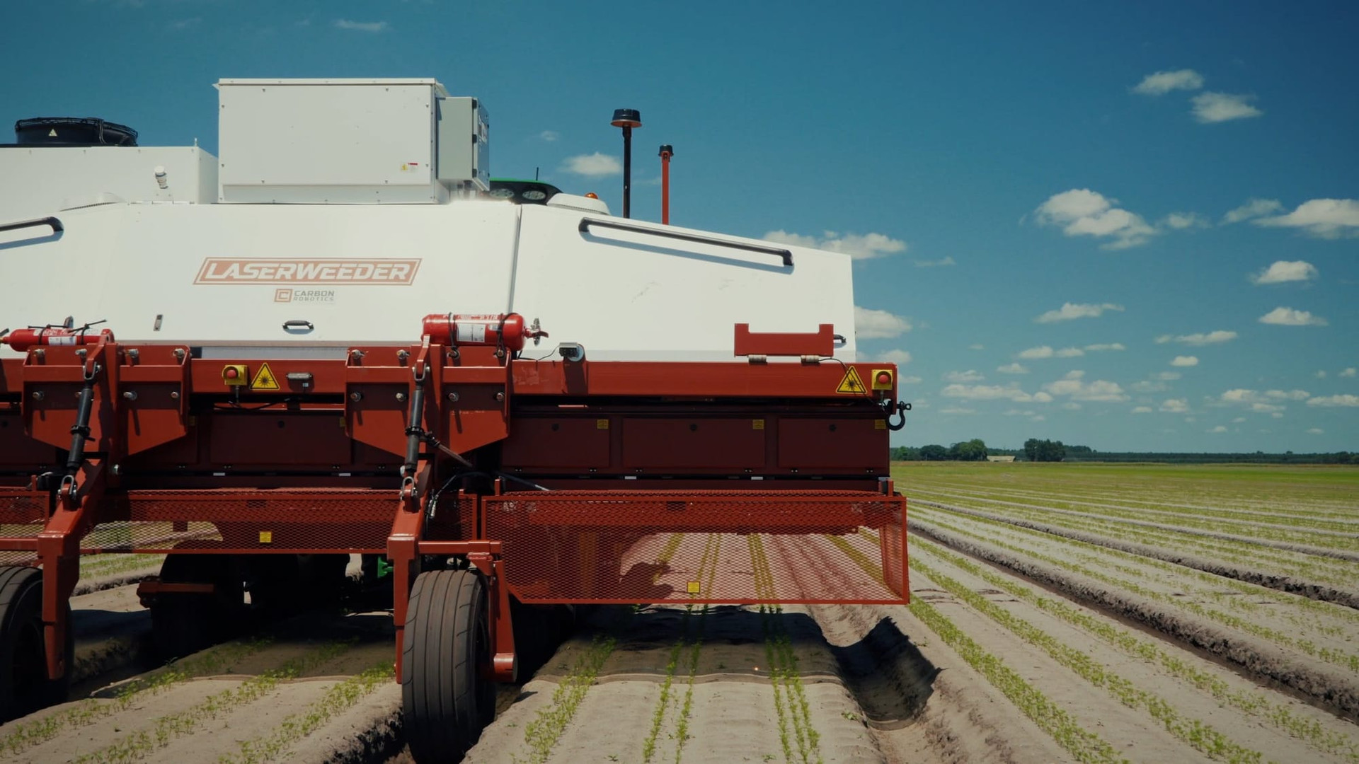 Carbon Robotics LaserWeeder machine working a row crop under open sky