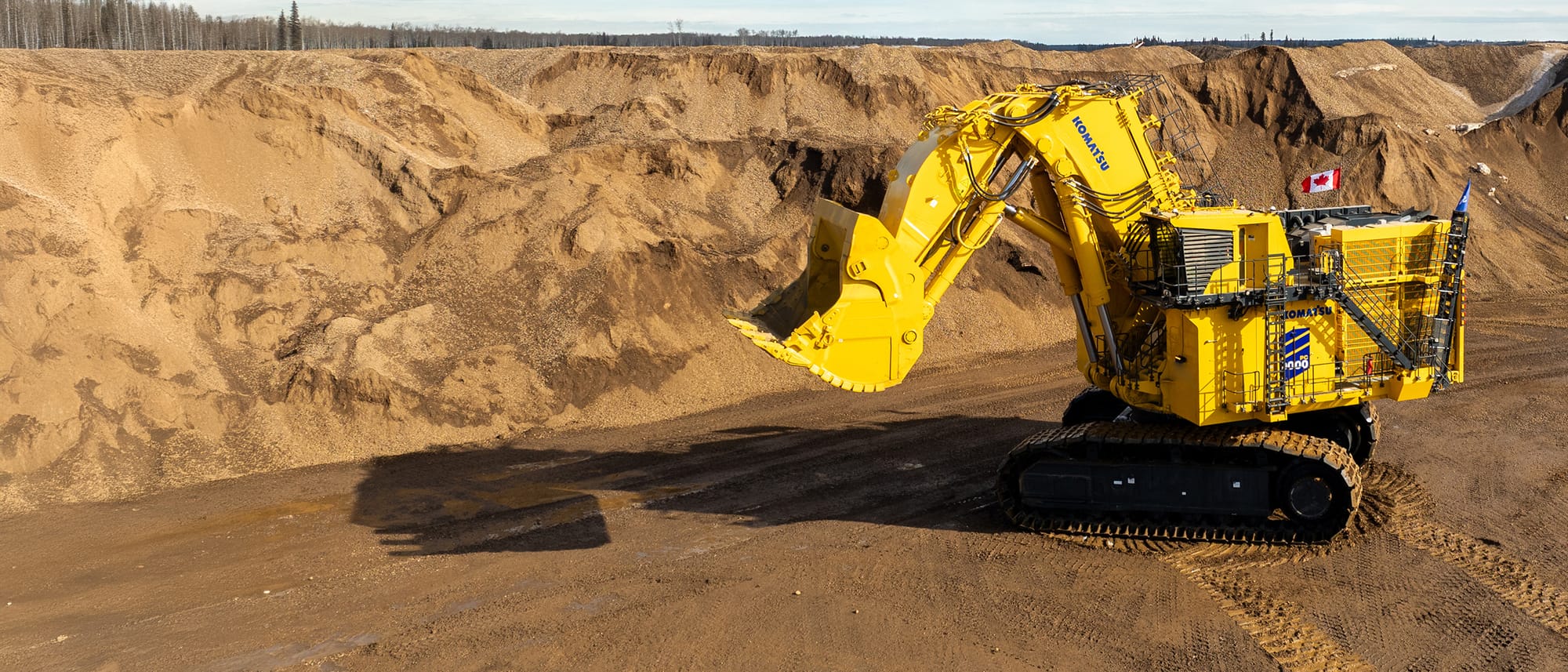 Komatsu PC9000 hydraulic mining excavator loading a haul truck