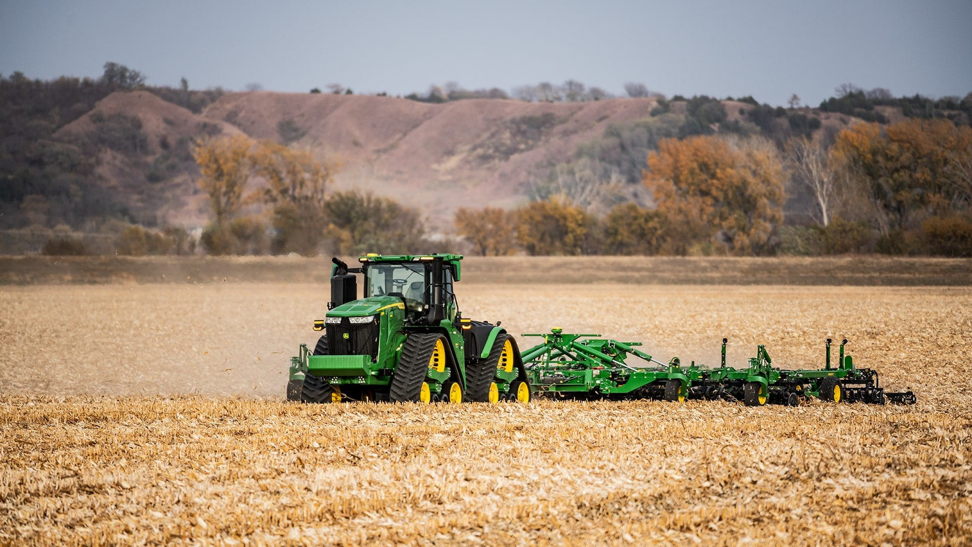 John Deere Autonomous 9RX tractor pulling tillage equipment with no operator in the cab