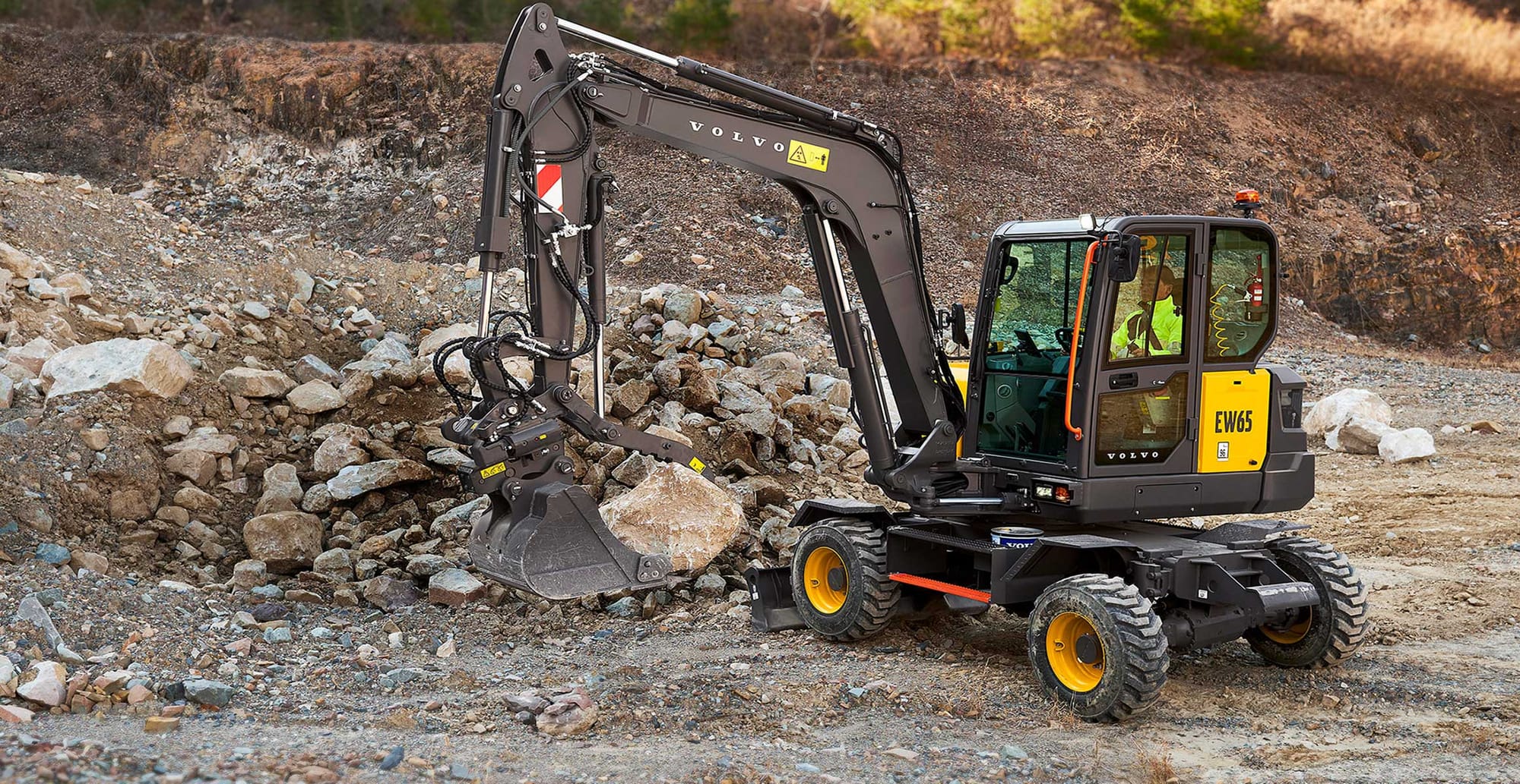 Volvo compact excavator from the new ECR90, EC65 and EW65 range working on site
