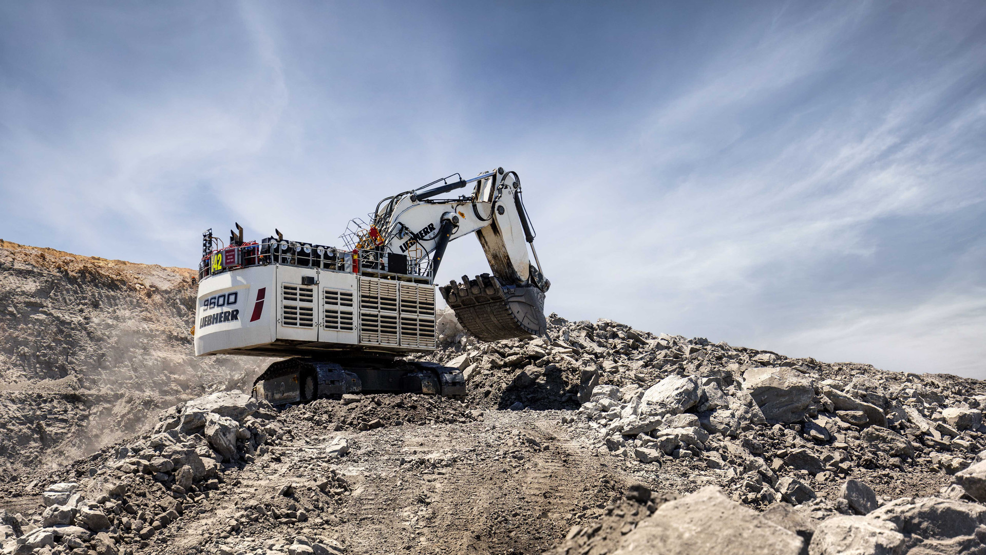 Liebherr R 9600 mining excavator on a blasted bench with the 9600 badge on the rear of the machine house